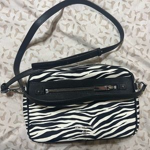 Brand new with tags. Never used. Michael Kors crossbody.